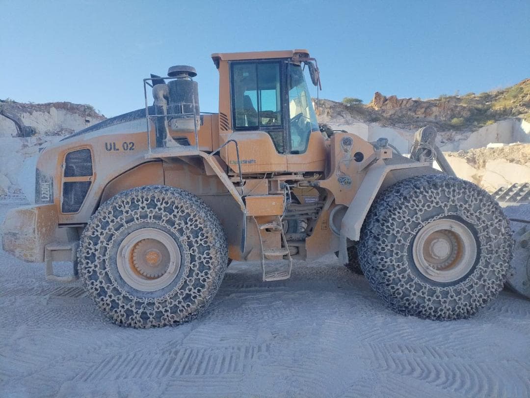 Wheel loader stationed on site in a quarry environment